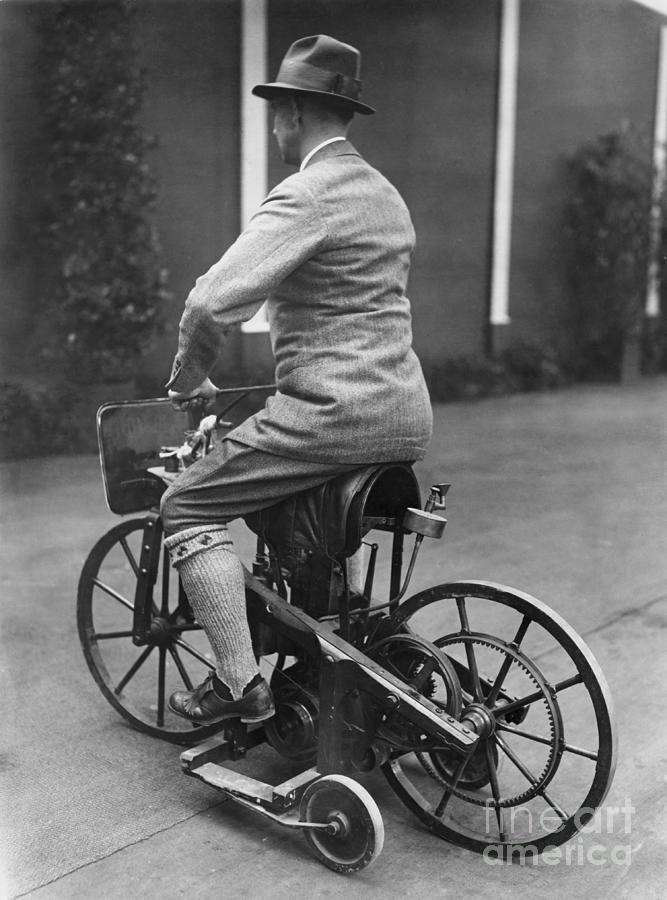 Man Riding Early Motorcycle Photograph by Bettmann