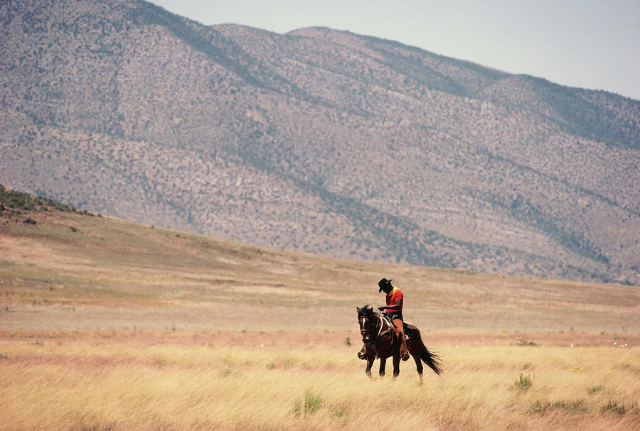 Man Riding Horse In Landscape Photograph by Christopher Pillitz