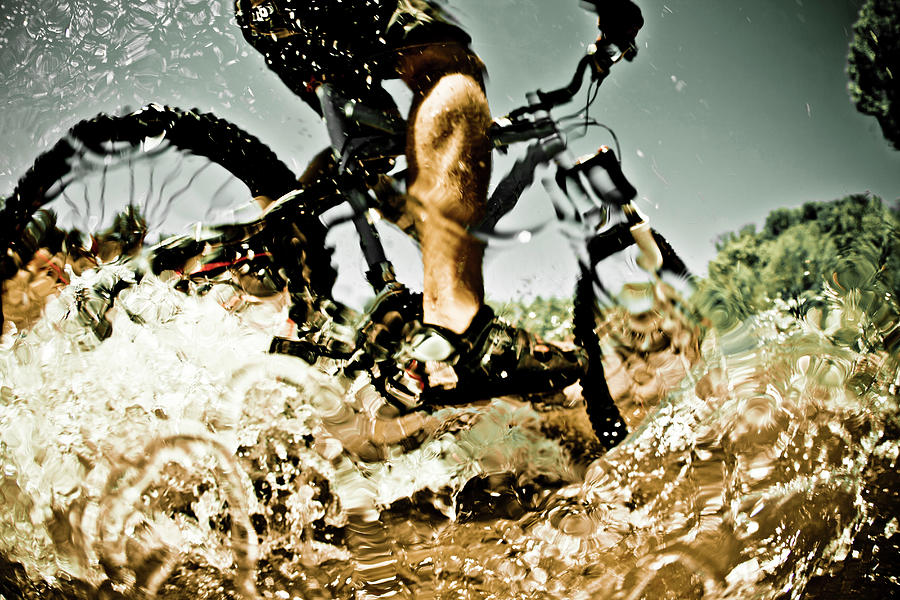 Man Riding Mountain Bike Through Water Photograph by Doug Berry