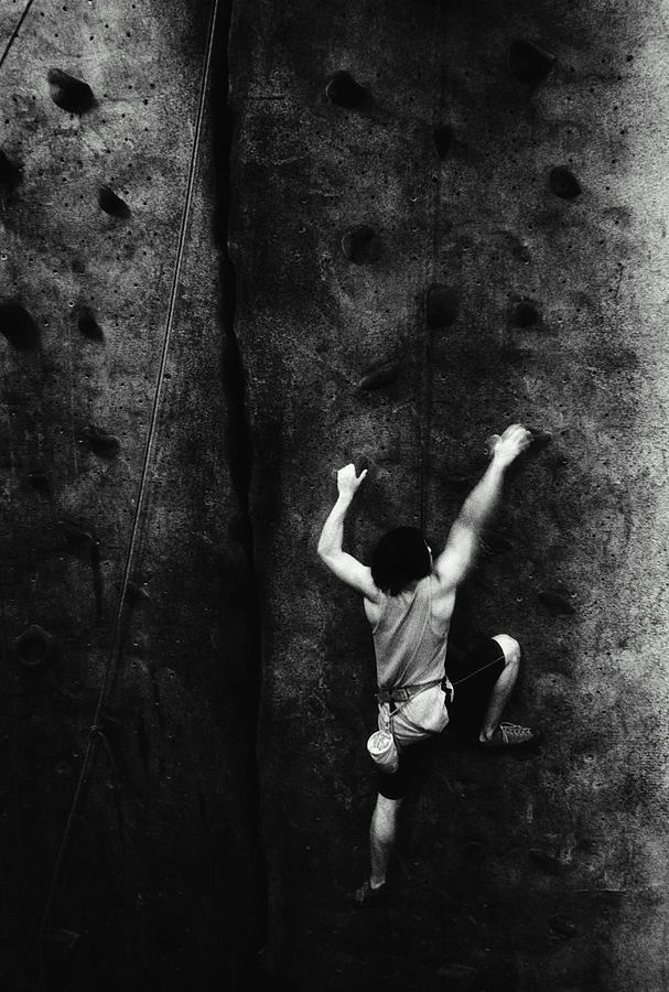 Man Rock Climbing, Indoors, Rear View Photograph by Joe Mcbride