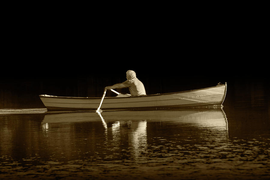 Man rowing on Stoney Lake at Sunrise in Sepia Tone Photograph by Randall Nyhof