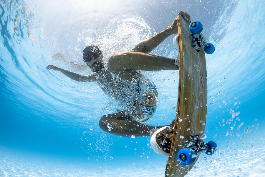 Water skate. Figure Skater Underwater. His into Skateboarding and swimming.