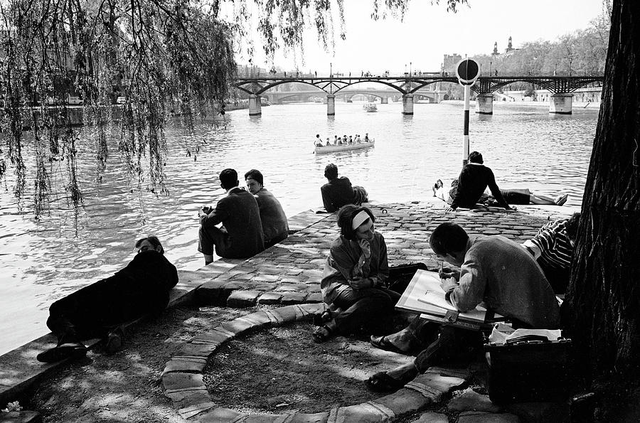 Black And White Photograph - Man Sketching & People Relaxing Along Seine by Alfred Eisenstaedt