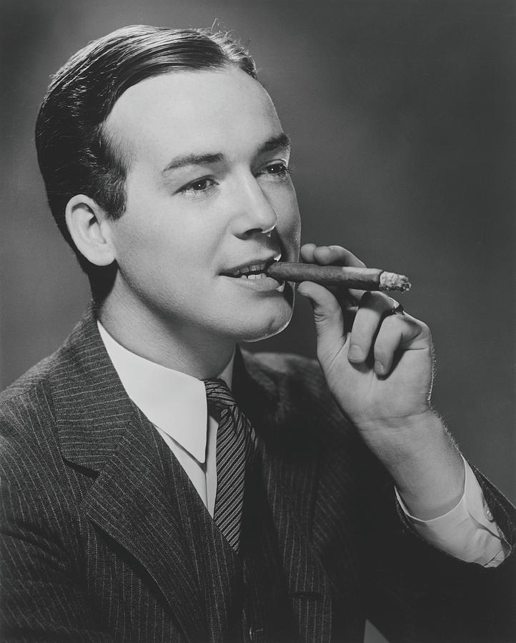Man Smoking Cigar In Studio, B&w Photograph by George Marks