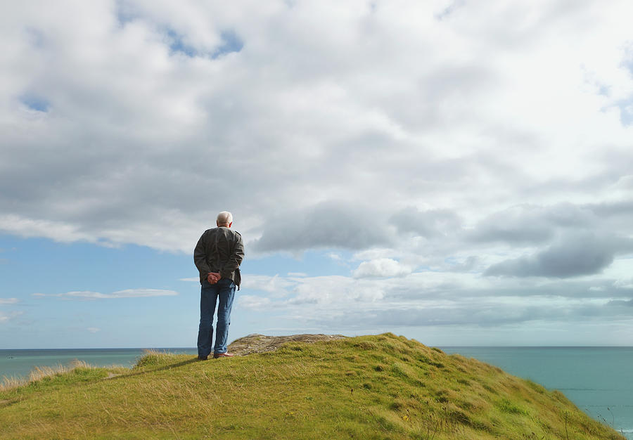 Man Standing Alone On A Hill Staring At Photograph by Ken Welsh / Design Pics