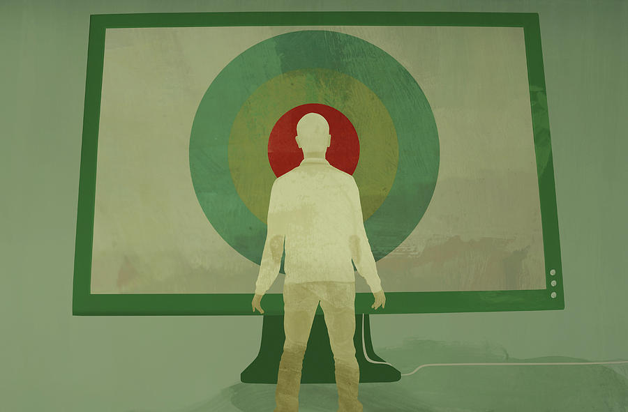 Man Standing In Front Of Large Target Photograph by Ikon Images