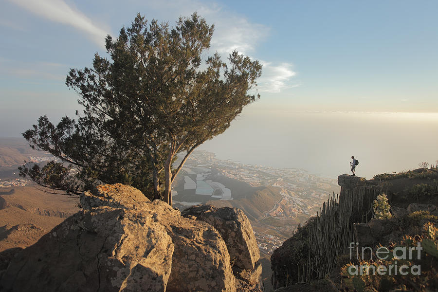 Man Standing On Rock Above City Photograph by Stanislaw Pytel