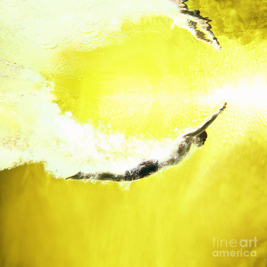 Man Swimming Underwater On Yellow Photograph by Stanislaw Pytel