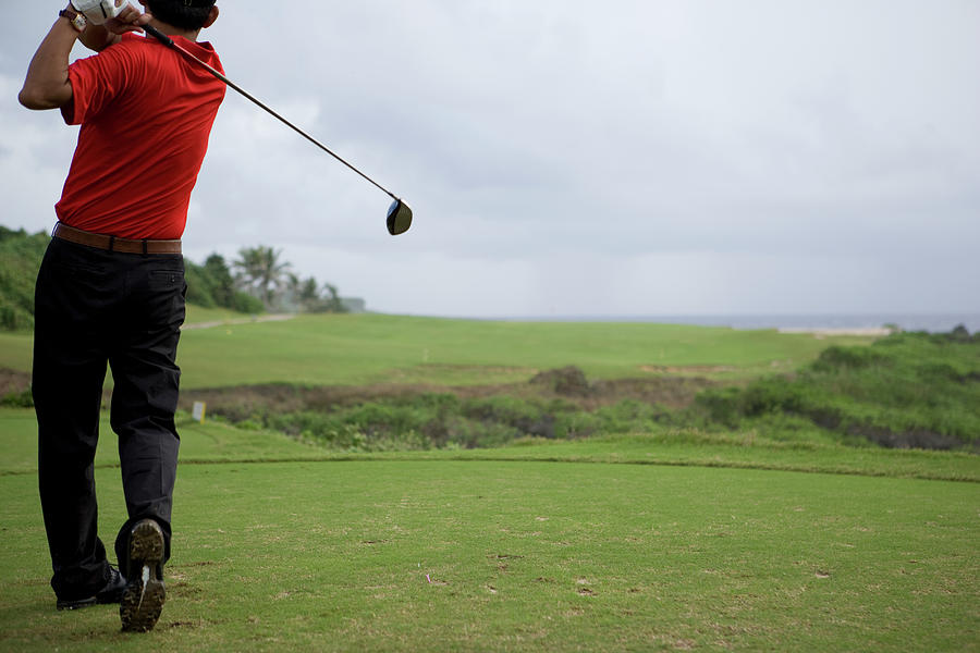 Man Swinging Golf Club, Rear View Photograph by Flashfilm