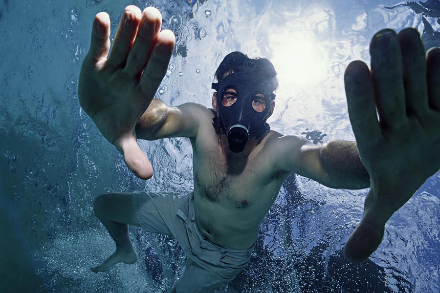 Man Underwater With A Gas Mask Photograph By Cavan Images