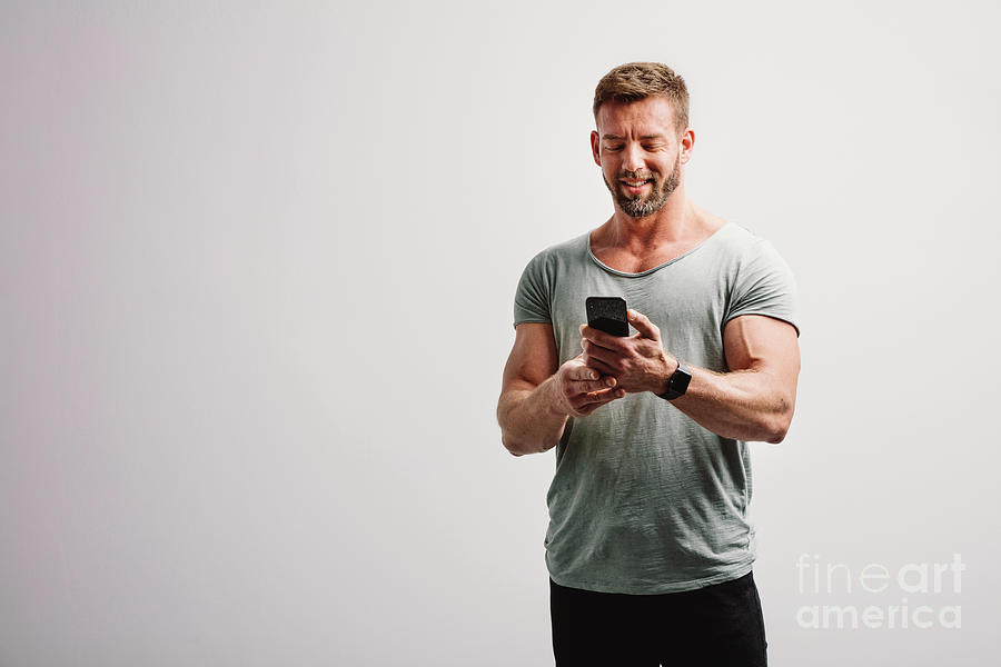 Man Using His Smartphone Smiling Photograph