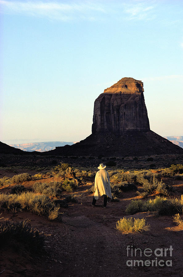 Man Walking In Monument Valley Photograph by Scott T. Baxter