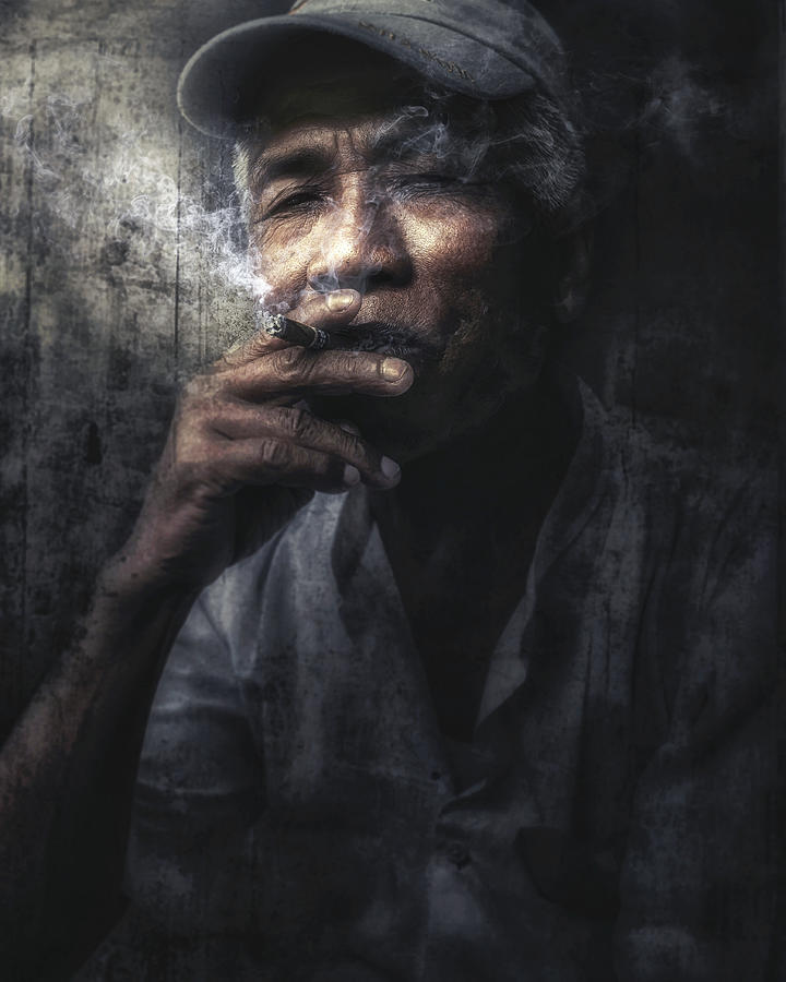 Man With Cigar, Myanmar. Photograph by Massimo Cuomo