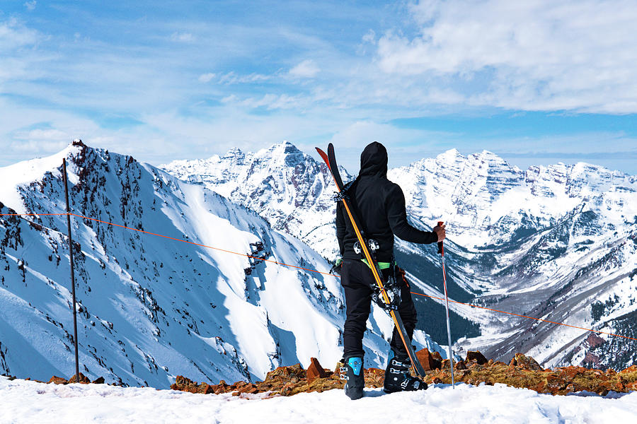 Winter Photograph - Man With Skis At Summit Extreme Ski Concept by Cavan Images