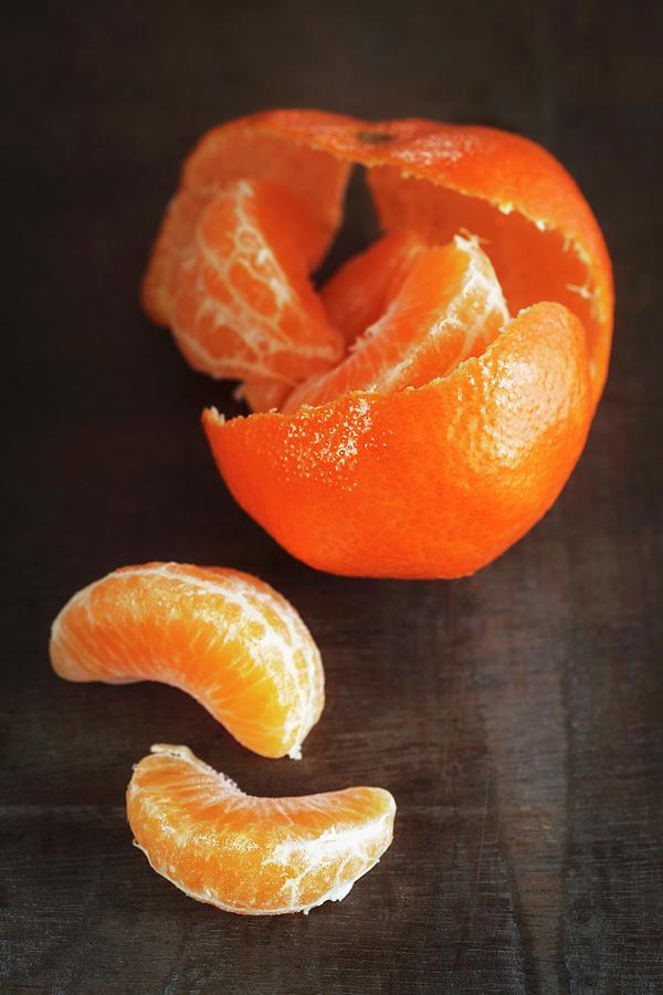 Fruit Photograph - Mandarins Being Peeled by Eva Grndemann