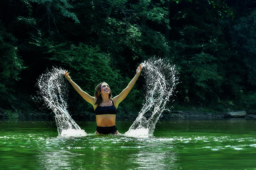 Mandy splashing water in the lake Photograph by Dan Friend