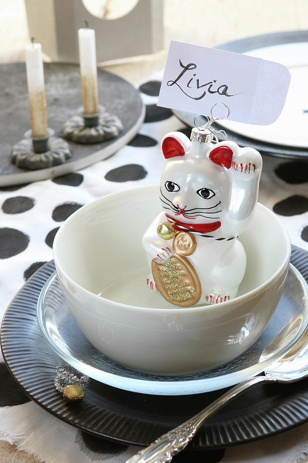 Maneki-neko Cat Used As Holder For Name Tag On Set Table Photograph by Regina Hippel