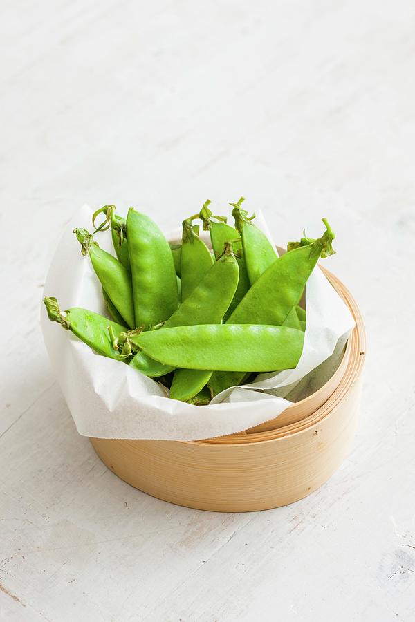 Mange Tout In A Bamboo Basket Photograph by Andrew Young