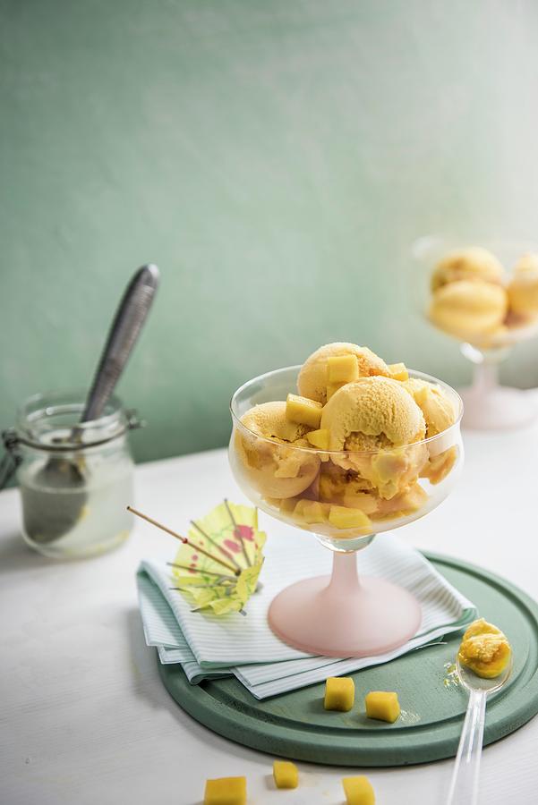 Mango Ice Cream With An Ice Cream Scoop Photograph by Magdalena Hendey