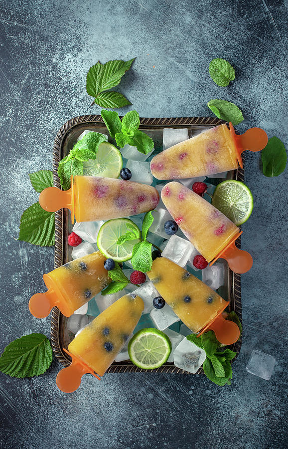 Mango Lollies With Blueberries Photograph by Andrey Maslakov