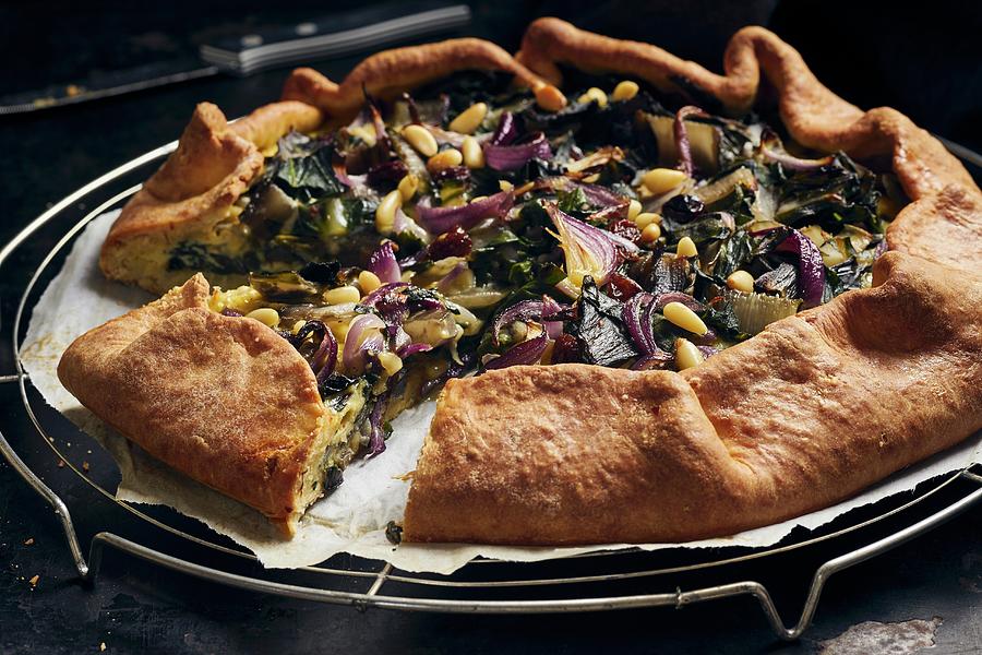 Mangold Quiche With Red Onions, Raisins And Pine Nuts Photograph by Ulrike Emmert
