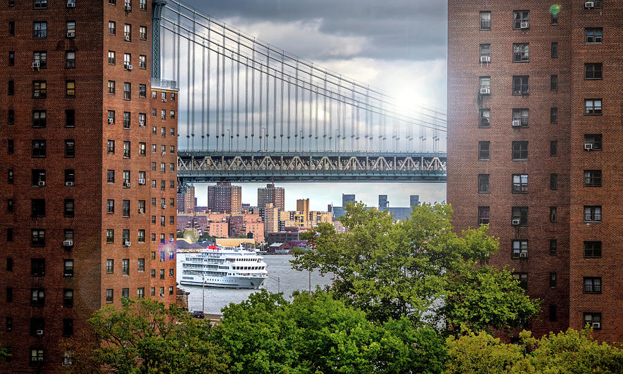 Manhattan Bridge between Condos Photograph by Patrick Boening