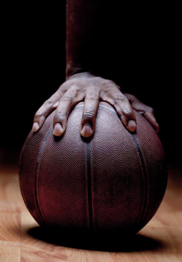 Mans Hand On Basketball Photograph by Pkline