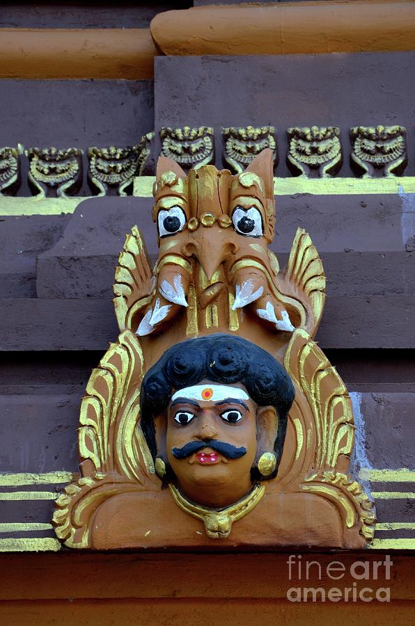 Mans head holy deity wood carving with fierce mythical animal creature at Nallur Kandaswamy Hindu t Photograph by Imran Ahmed