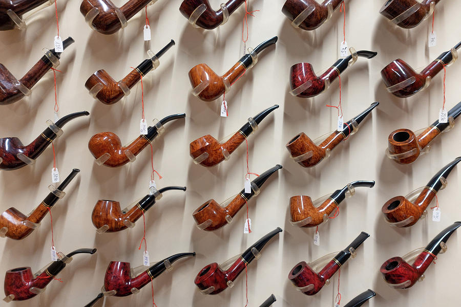 Many Tobacco Pipes Are Hanging On A Wall In A Tobacco Shop Photograph ...