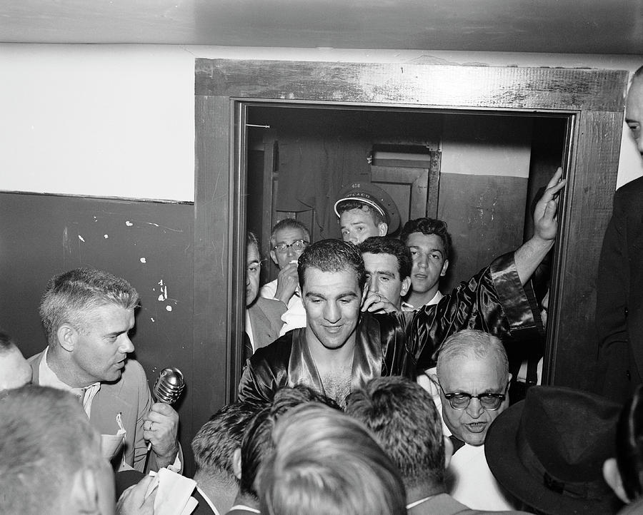 Black And White Photograph - Marciano Talks With Reporters by Eliot Elisofon