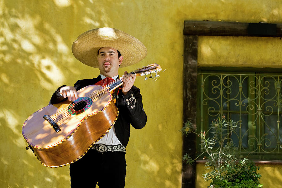 Mariachi Playing Guitar Photograph by Cristianl