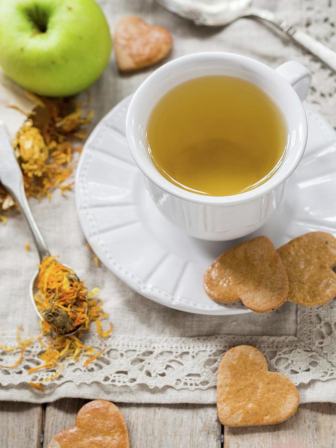 Marigold Tea And Heart-shaped Biscuits Photograph by Magdalena Paluchowska