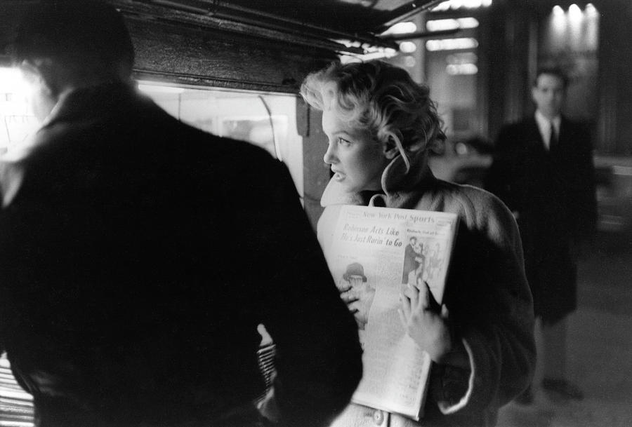 Marilyn Gets A Paper Photograph by Michael Ochs Archives
