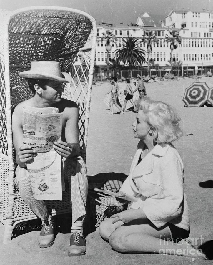 Marilyn Monroe And Tony Curtis Relaxing Photograph by Bettmann