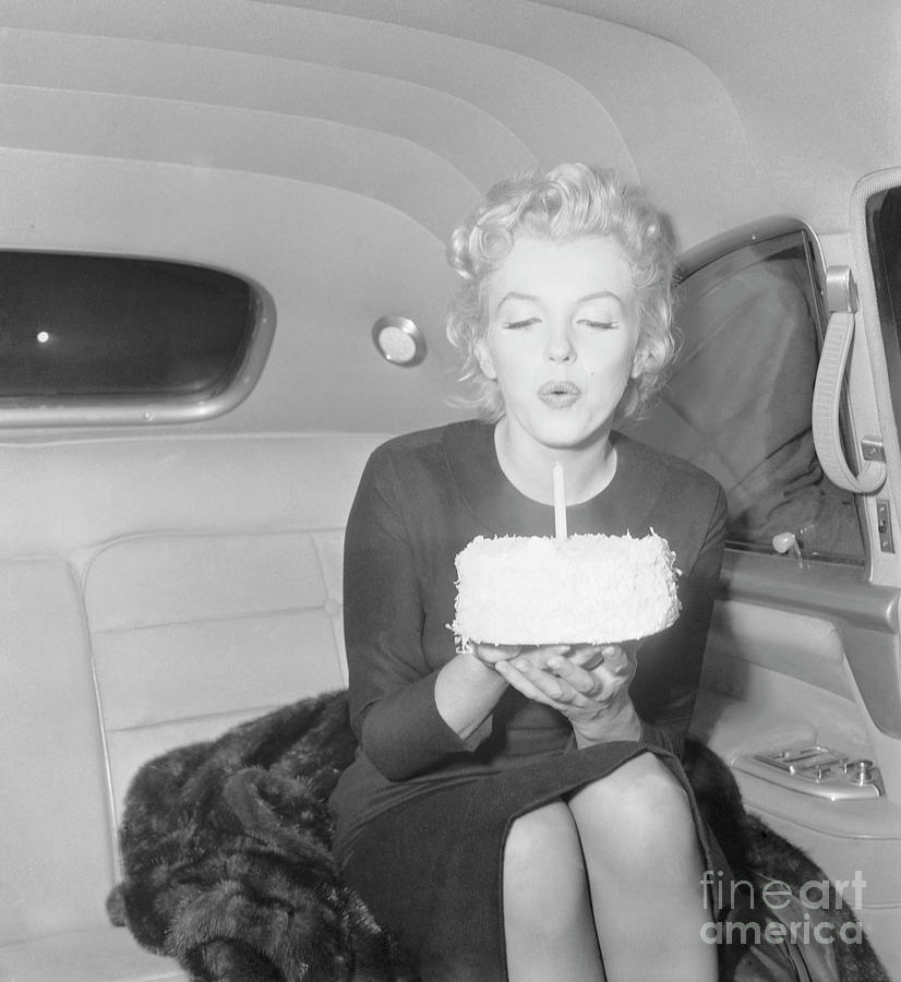 Marilyn Monroe Blowing Out Candle Photograph by Bettmann
