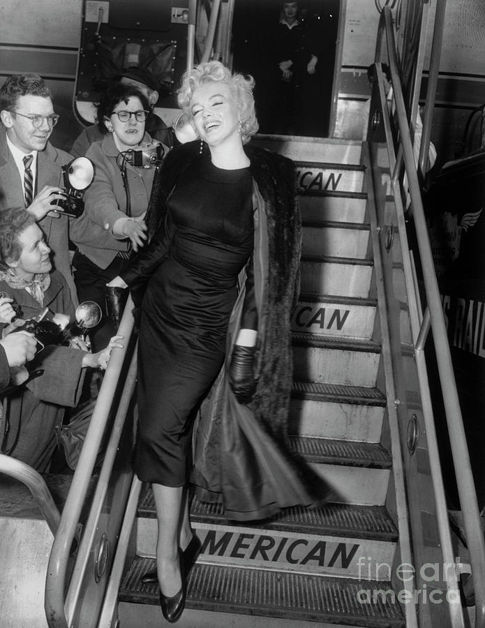 Marilyn Monroe Boarding Airplane Photograph by Bettmann
