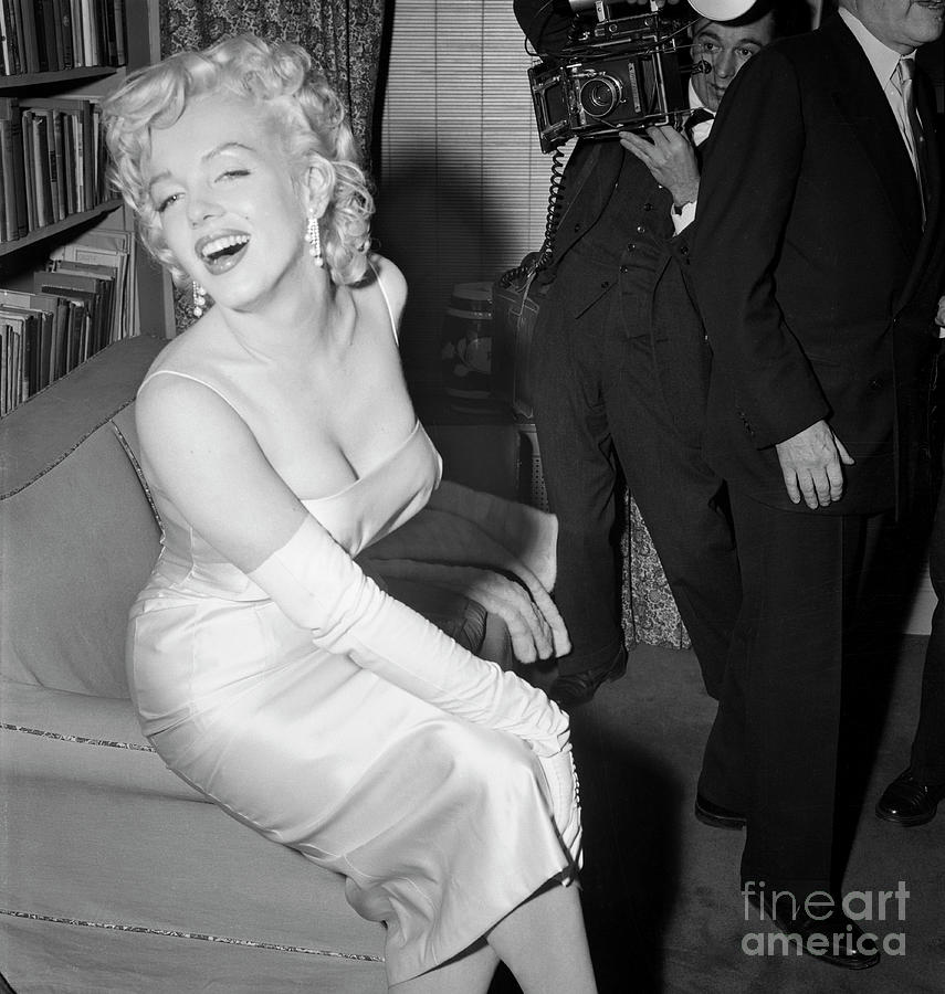 Marilyn Monroe Posing For A Photographer Photograph by Bettmann