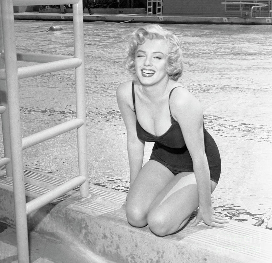 Marilyn Monroe Sitting By Pool Photograph by Bettmann