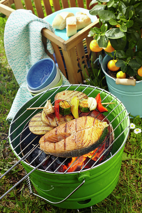 Marinated Cajun Salmon, Vegetables Skewers And Spicy Potatoes On A Barbecue Photograph by Teubner Foodfoto