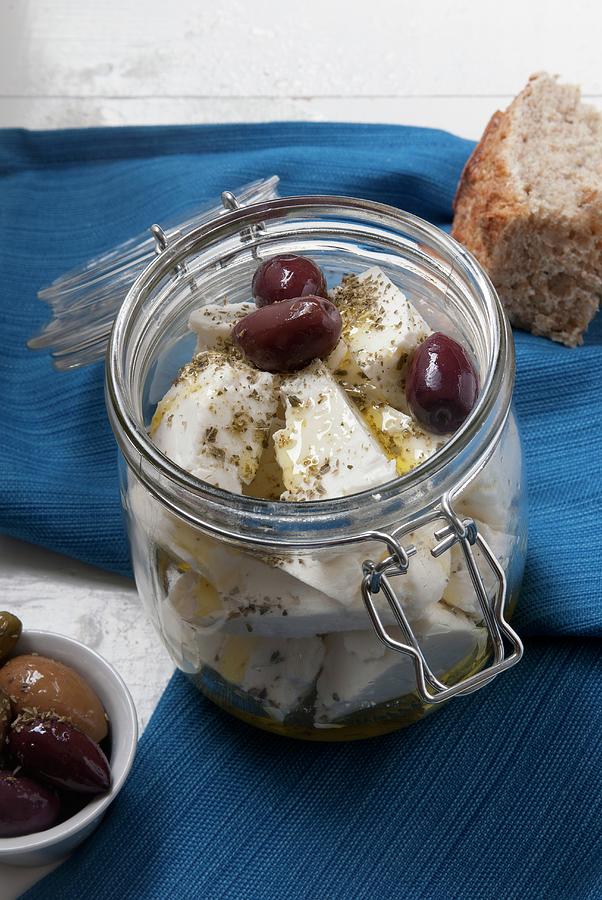 Marinated Feta Cheese In A Preserving Jar With Oregano, Olive Oil And Kalamata Olives Photograph by Spyros Bourboulis