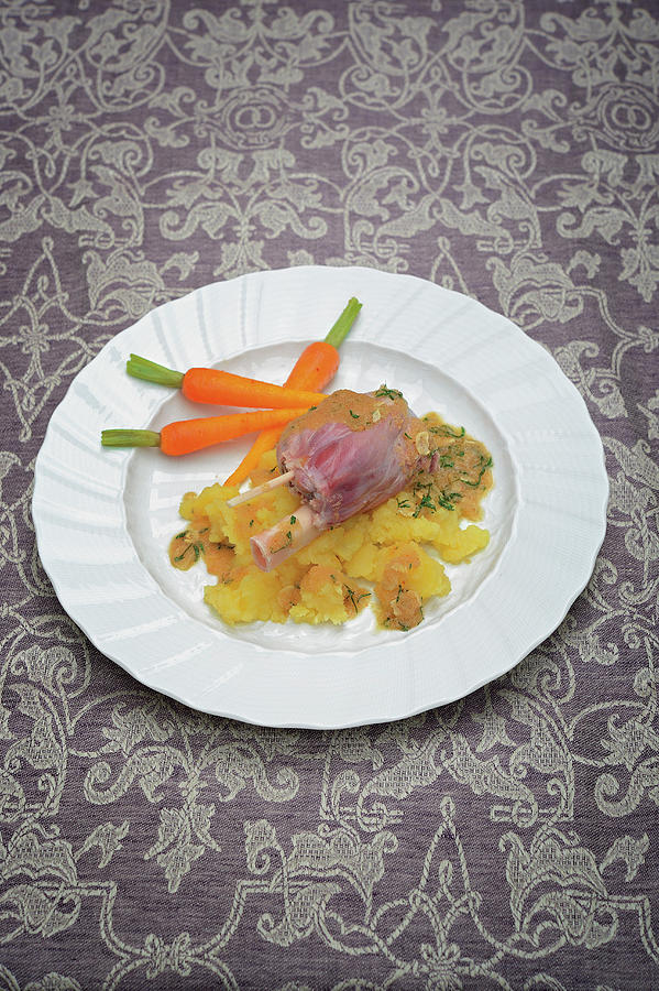 Marinated Knuckle Of Wild Boar With Potato Gratin And Baby Carrots Photograph by Torri Tre