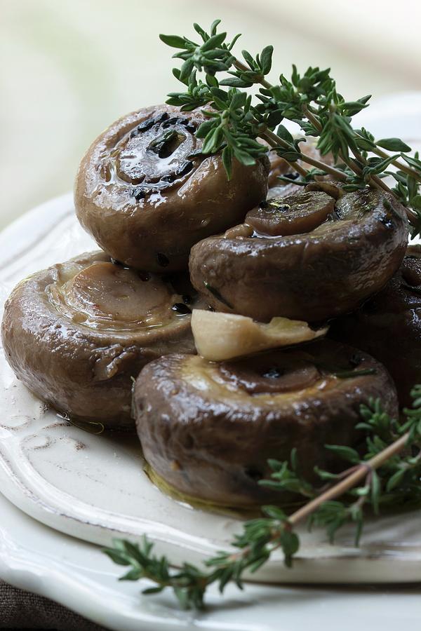 Marinated Mushrooms With Fresh Thyme, Black Caraway And Garlic Photograph by Charlotte Von Elm