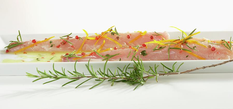 Marinated Rabbit Fillet With Rosemary, Pink Peppercorns And Orange Zest Photograph by Teubner Foodfoto