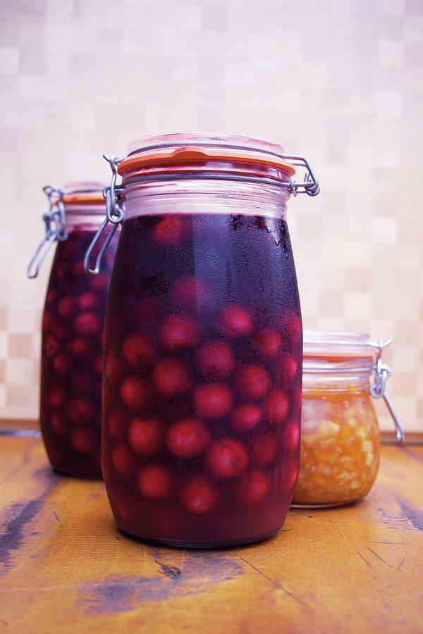Marinated Sour Cherries In A Jar Photograph by Michael Wissing