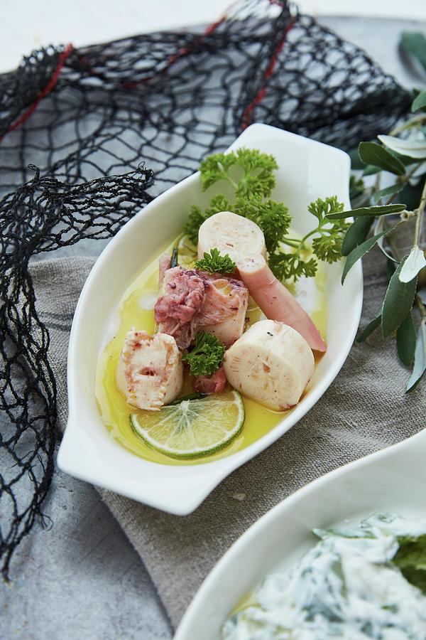 Marinated Squid In Oil With Parsley And Lime Photograph by Liv Friis