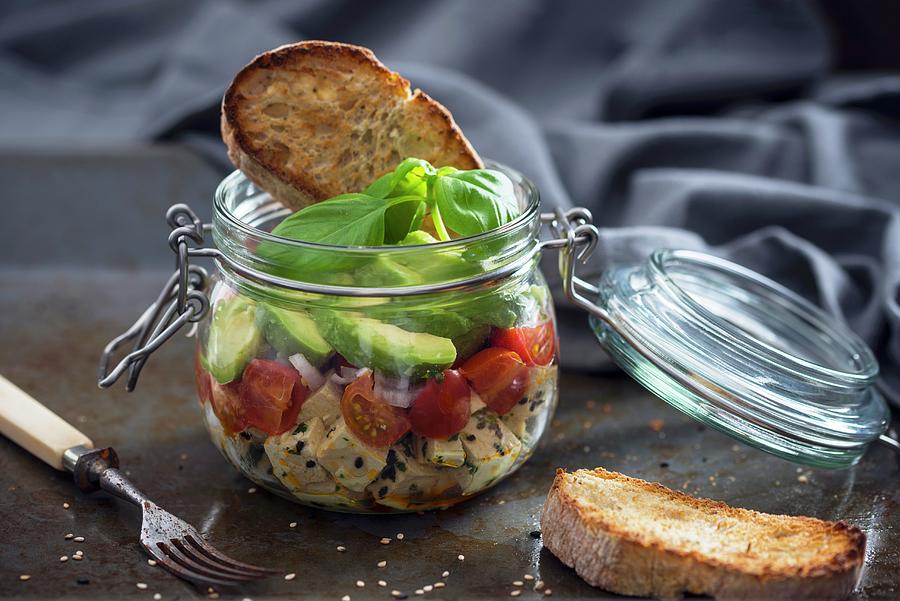 Marinated Tofu With Sesame Seeds, Tomatoes, Shallots, Avocado And Toast In A Glass Jar Photograph by Kati Neudert