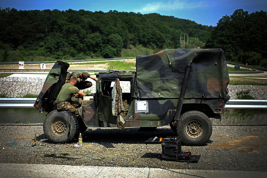Marine Photograph - Marine Mechanics Fix A Humvee At Camp by Stocktrek Images Marine Photograph - Marine Mechanics Fix A Humvee At Camp by Stocktrek Images