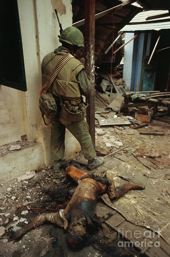 Marine Next To Remains Of Viet Cong Photograph by Bettmann