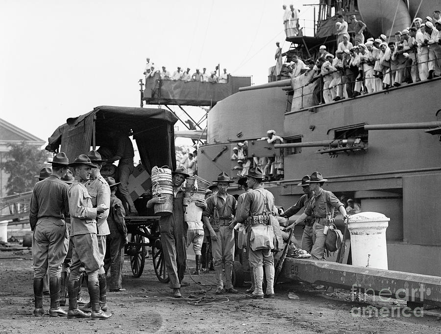 Marines Load Supplies Onto Boat Photograph by Bettmann