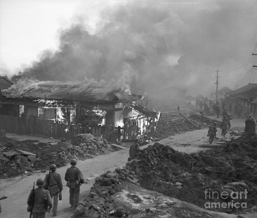 Marines Pass Burning Building In Korea Photograph by Bettmann